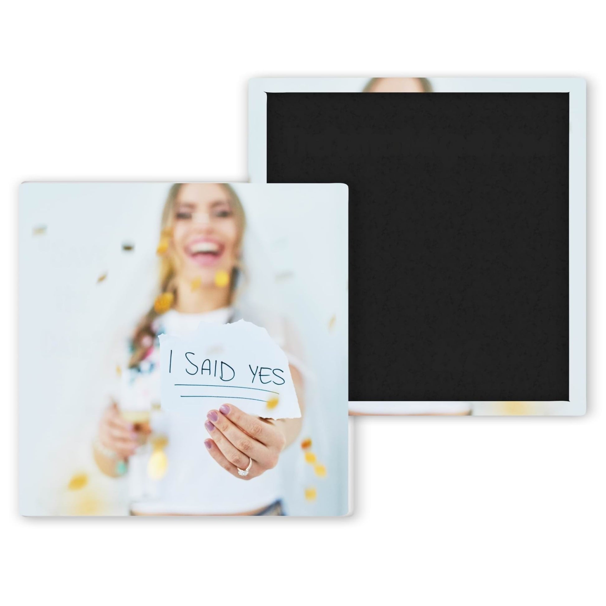 bride to be holding I Said Yes sign