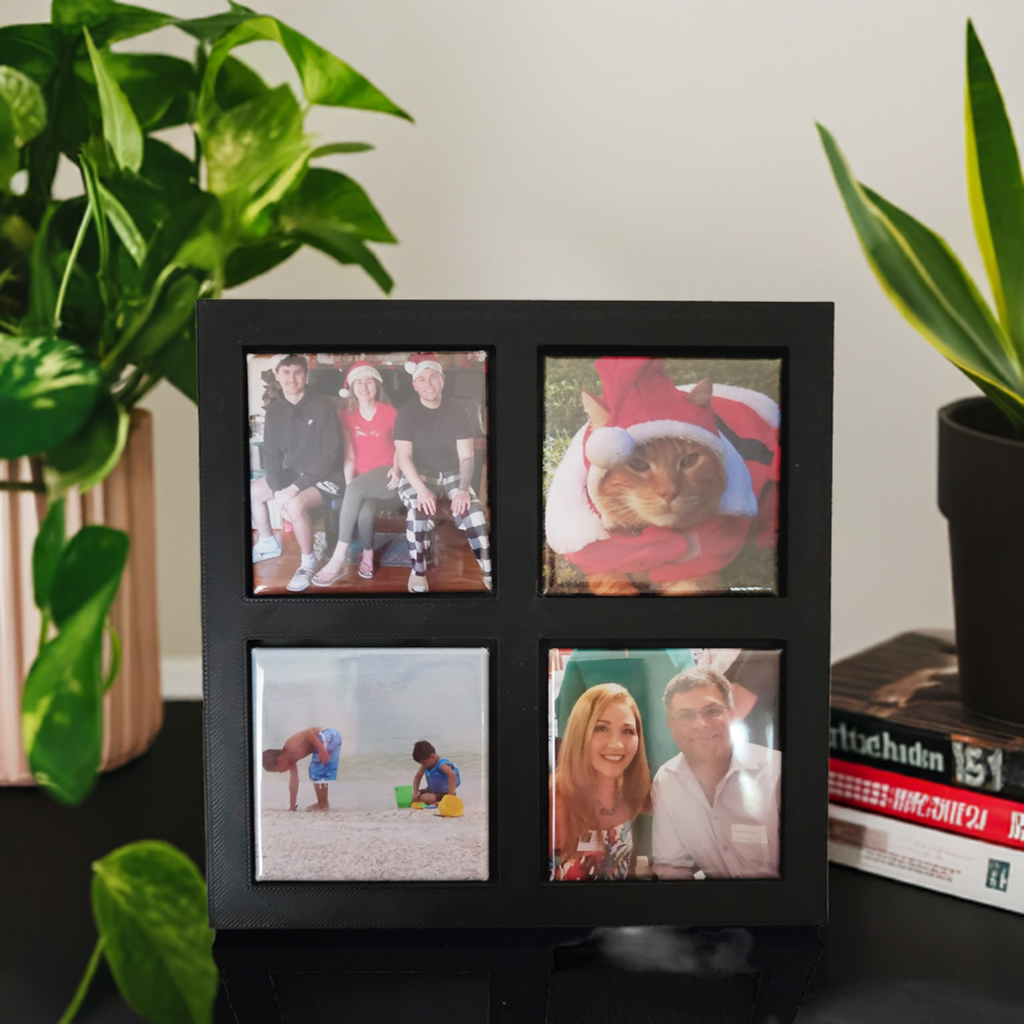 Front view of Black magnetic frame with 4 photo magnets
