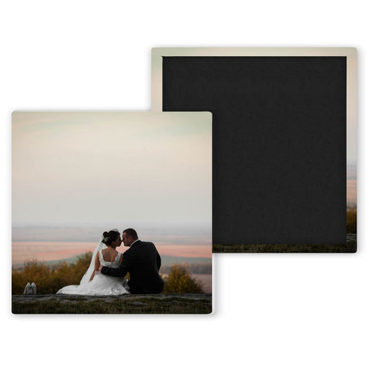 bride and groom sitting on a field